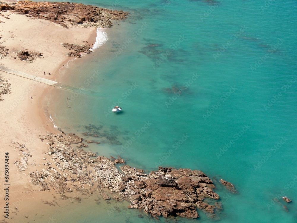 A view of the turquoise waters of Broome from the air