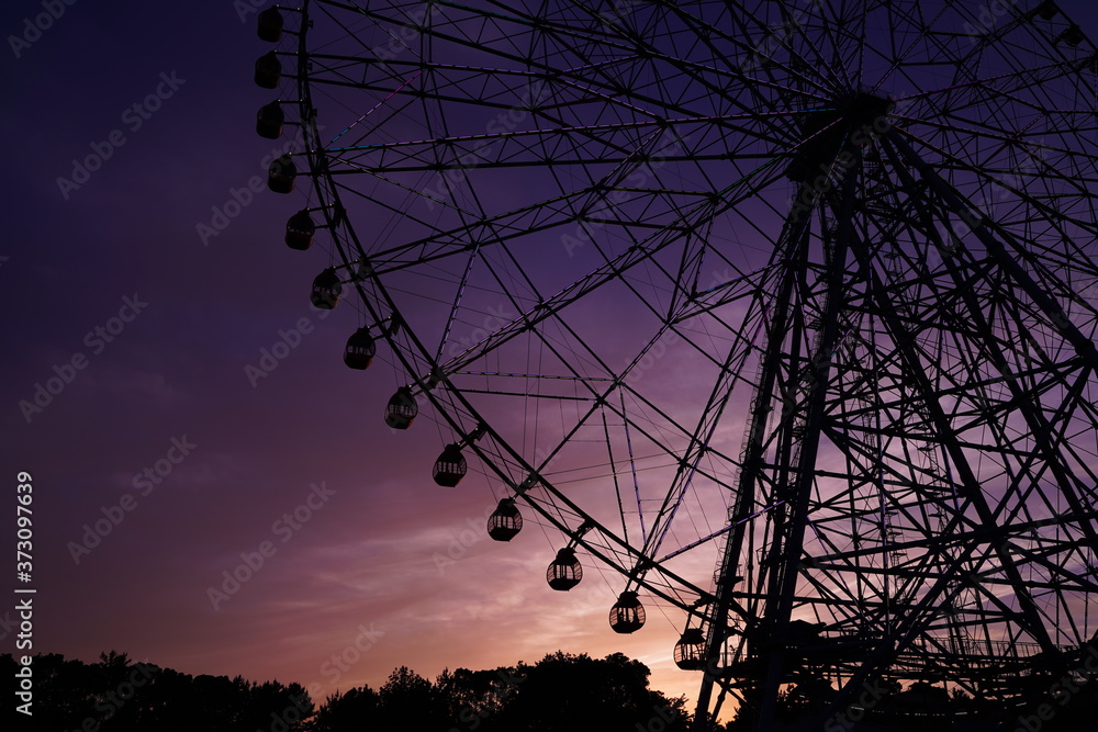 Ferris wheel after sunset at Kasai Rinkai koen, Tokyo, Japan. Purple and blue sky is beautiful.