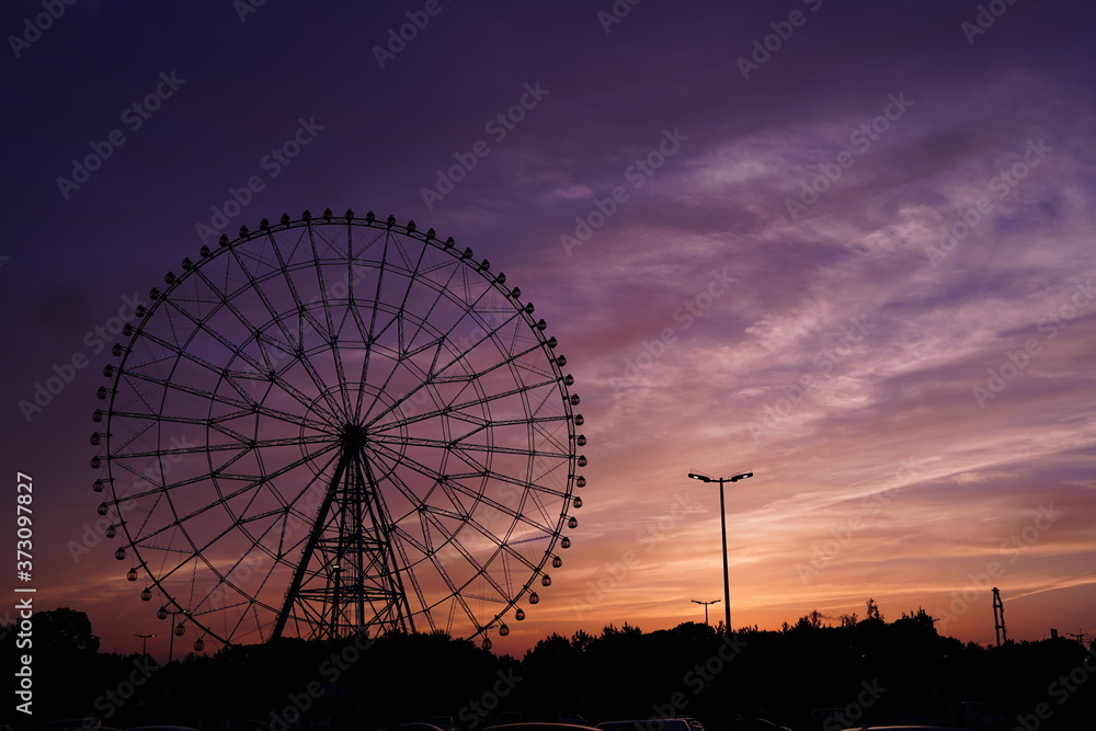 Ferris wheel after sunset at Kasai Rinkai koen, Tokyo, Japan. Purple and blue sky is beautiful.