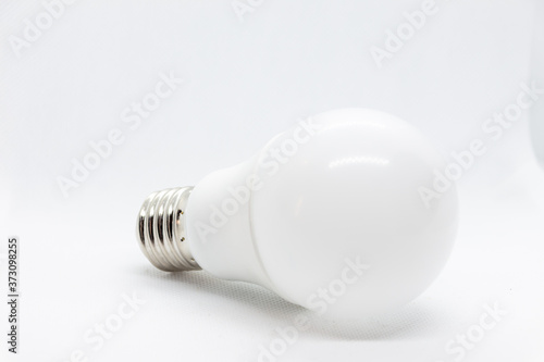 White light bulb on white background