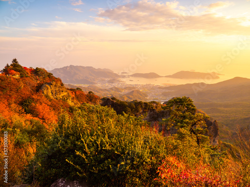 The Landscape of Mountains with Maple Leaves after Sunset in Autumn or Fall, Kankakei in Kagawa Prefecture in Japan 