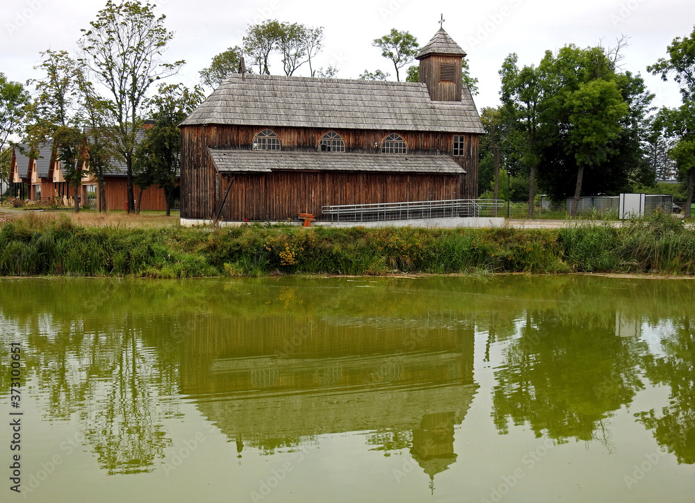 Fototapeta premium built in 1932, a wooden Roman Catholic branch church dedicated to God's Mercy at the palace and park complex in the city of Łochów in Masovia, Poland