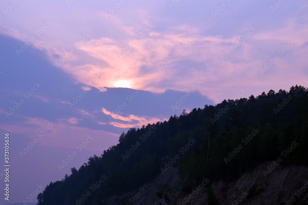 Fototapeta premium mountain silhouette at sunset.
