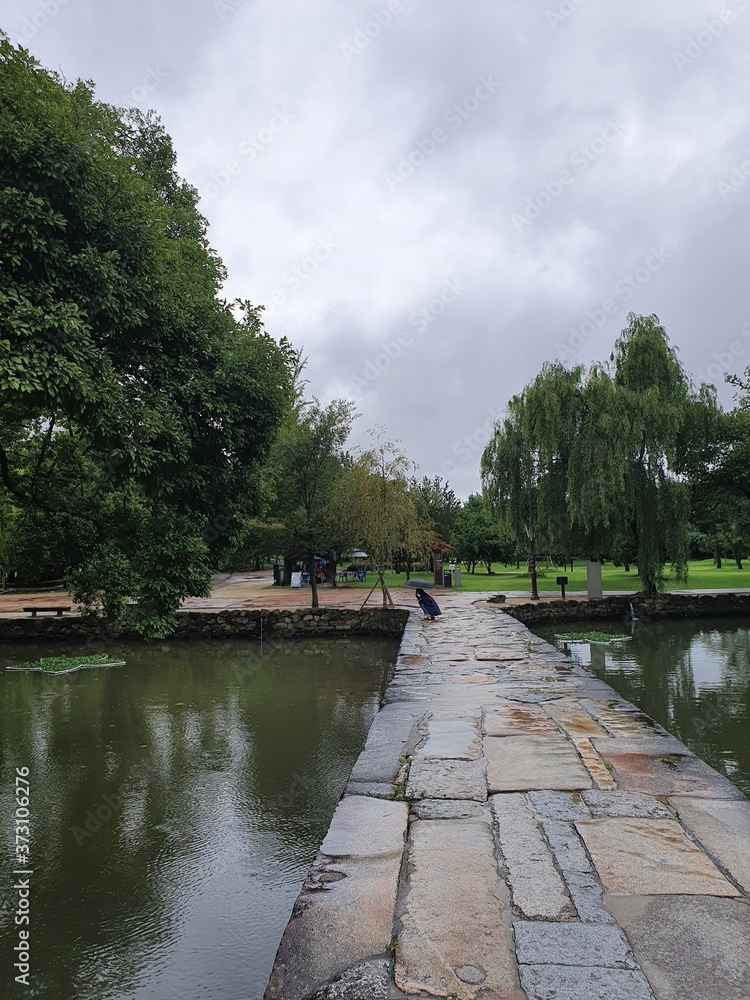 Fototapeta premium Namwon-si, Jeollabuk-do, South Korea - 24th July 2020 : Scenery of Gwanghallu Garden or Gwanghallu Pavilion on a rainy day