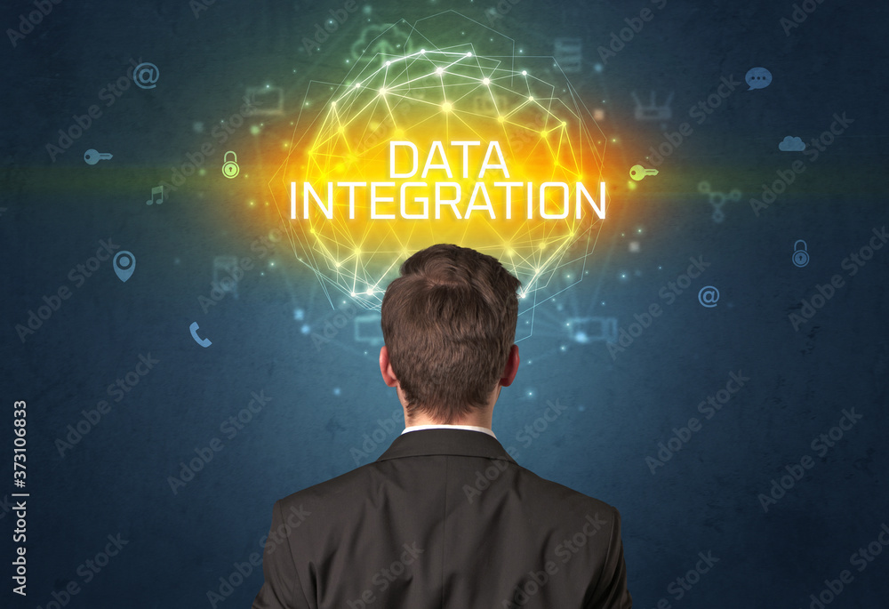 Rear view of a businessman with DATA INTEGRATION inscription, online security concept Rear view of a businessman with DATA INTEGRATION inscription, online security concept