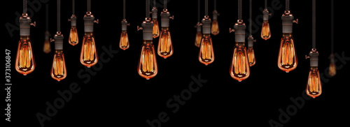 Billede på lærred gruppe von edison hängelampen in leuchtendem zustand mit schönen vintage glühbir