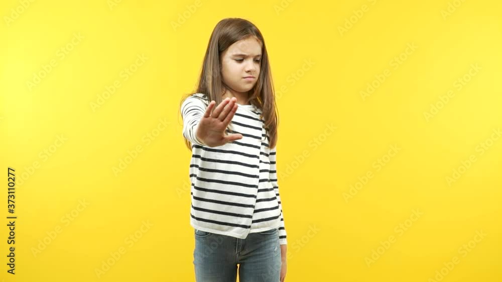 Funny little child girl putting hand in front Funny little child girl putting hand in front