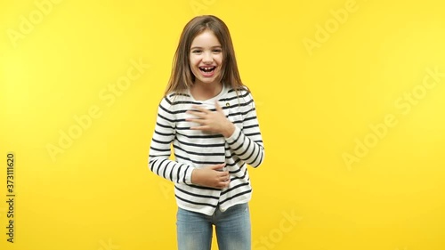 Funny little child girl laughing and having fun