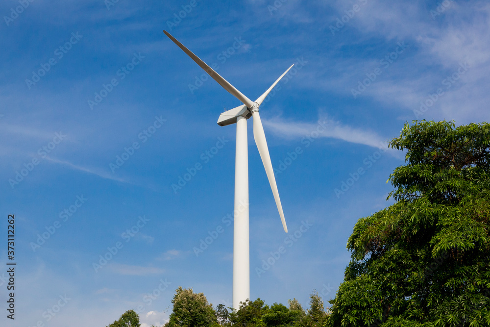 Wind Turbines in the with blue cloudy sky Wind Turbines in the with blue cloudy sky