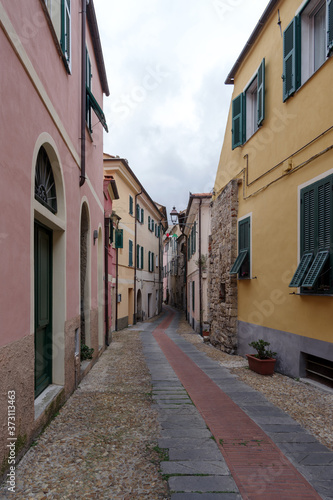 Typical Italian narrow street  Diano Castello ancient village  Province of Imperia  Italy