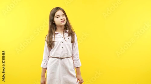 Funny little child girl winking