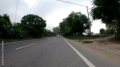 Car leading by a moving bike