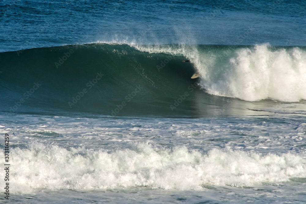 surfer in big waves