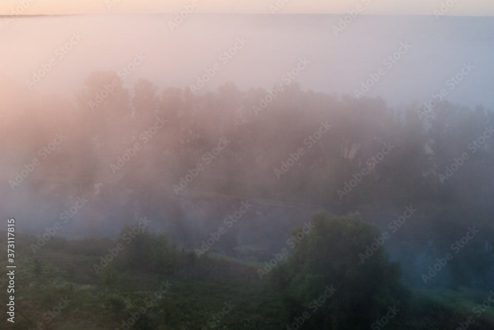 Sunrise over the cliff.
Morning haze at dawn on a cliff in summer.
freshness