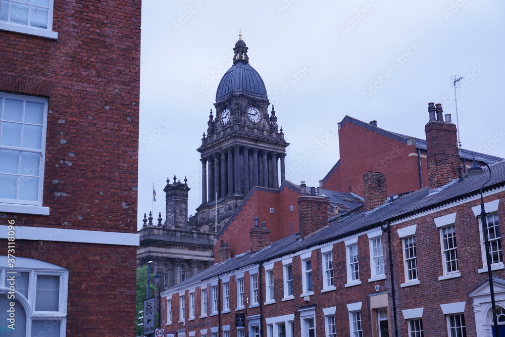 Beautiful shot of Town Hall from Park Square. The clock tower of Leeds Town Hall towers over, displaying old Georgian grandeur. The clock tower it self was built later in Victorian era. 