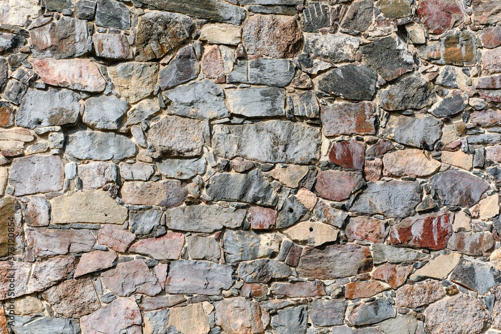 Natural stone wall texture for background.