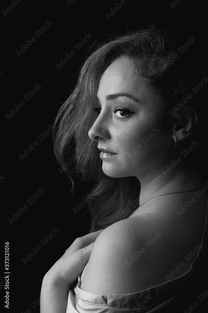 Portrait of beautiful women with bare shoulder in monochrome side view Portrait of beautiful women with bare shoulder in monochrome side view