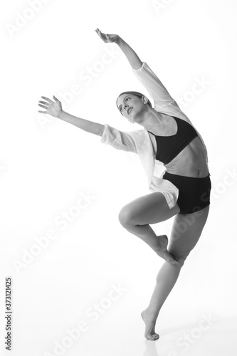  Young beautiful dancer posing on a studio background. Black and white. Isolated © liliportfolio