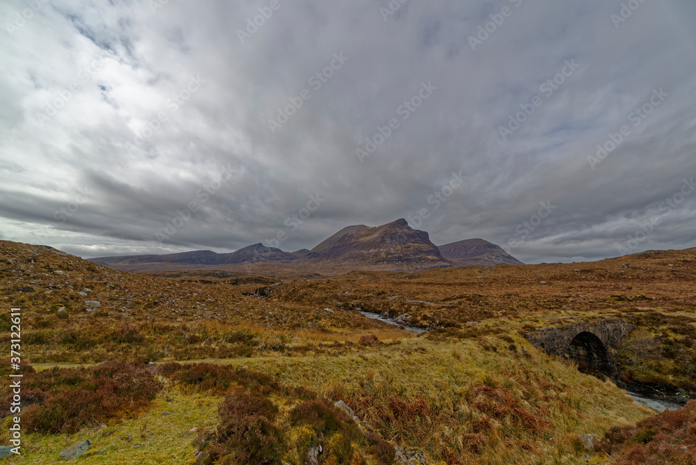 The Old Stone Road Bridge on the route of the North Coast 500 as you head North towards Smoo Cave in the Highlands of Scotland. The Old Stone Road Bridge on the route of the North Coast 500 as you head North towards Smoo Cave in the Highlands of Scotland.