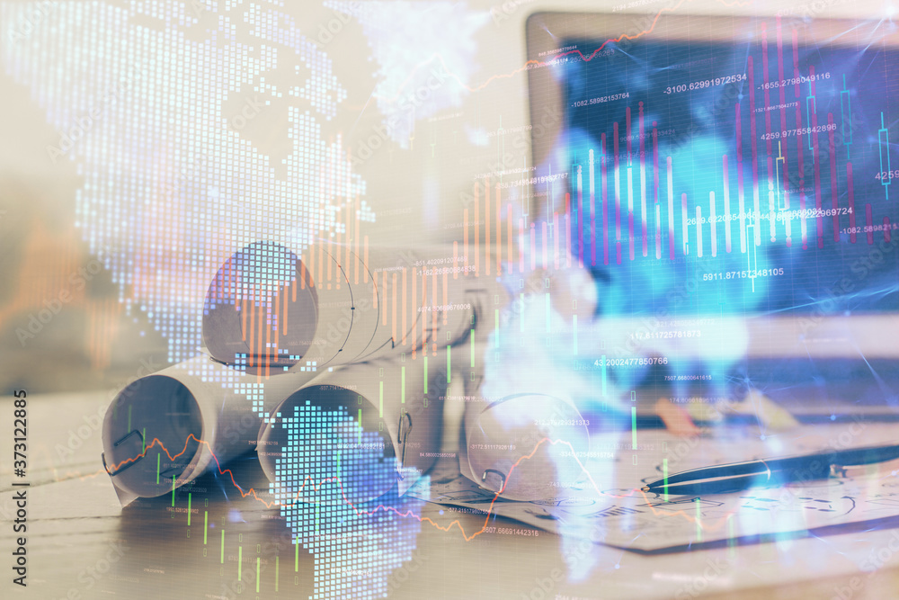 Obraz premium Financial chart drawing and table with computer on background. Double exposure. Concept of international markets.