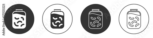 Black Pickled cucumbers in a jar icon isolated on white background. Circle button. Vector Illustration.