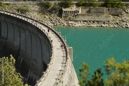 dam and emerald water for power production photo