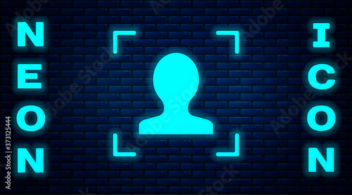Glowing neon Face recognition icon isolated on brick wall background. Face identification scanner icon. Facial id. Cyber security concept. Vector.