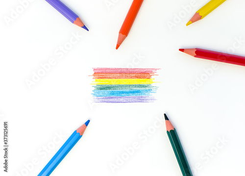 Colored pencils around the lgbt rainbow flag