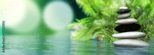 Canvas Print Pyramid of stones over water, zen still life, spa pyramid on a blurred backgroun