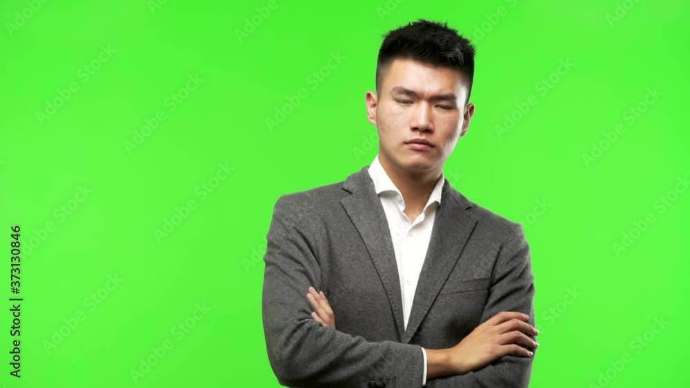 Young chinese business man looking straight ahead Young chinese business man looking straight ahead