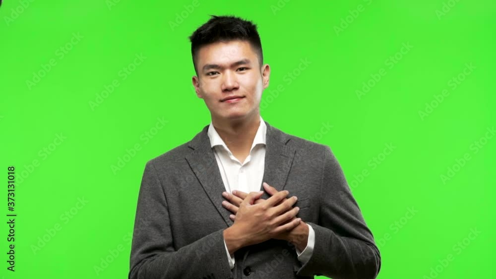 Young chinese business man doing a romantic gesture Young chinese business man doing a romantic gesture