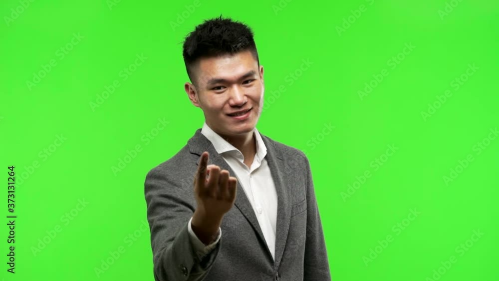 Young chinese business man inviting to come Young chinese business man inviting to come