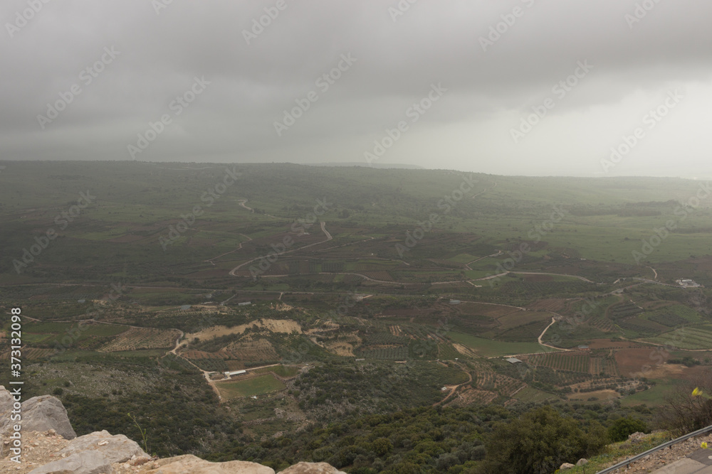 Fototapeta premium Clouds over the mountains in Golan Heights, Israel.