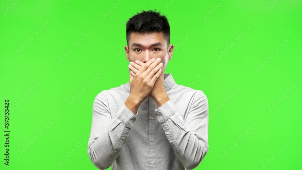 Young handsome chinese man surprised and shocked Young handsome chinese man surprised and shocked