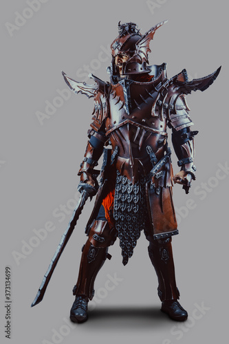 Obraz na plátne Powerful knight in armor with the sword