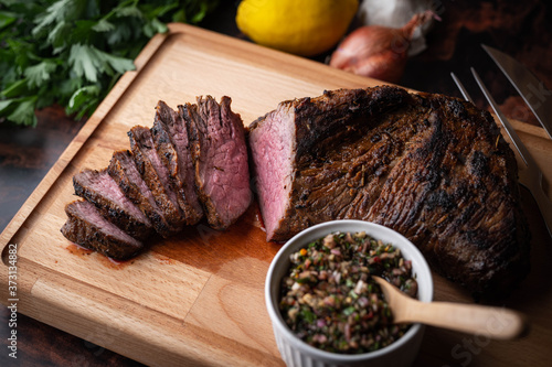 grilled tri tip steak with chimichurri sauce photo