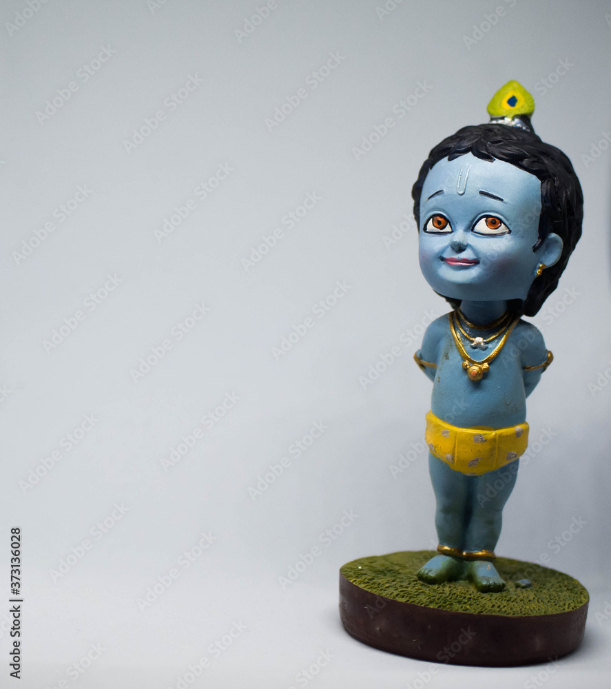 Cute and innocent idol of Hindu God Lord Krishna Stock Photo | Adobe Stock