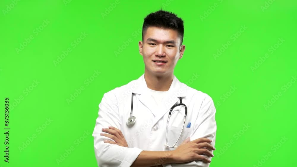 Young chinese doctor man crossing his arms Young chinese doctor man crossing his arms