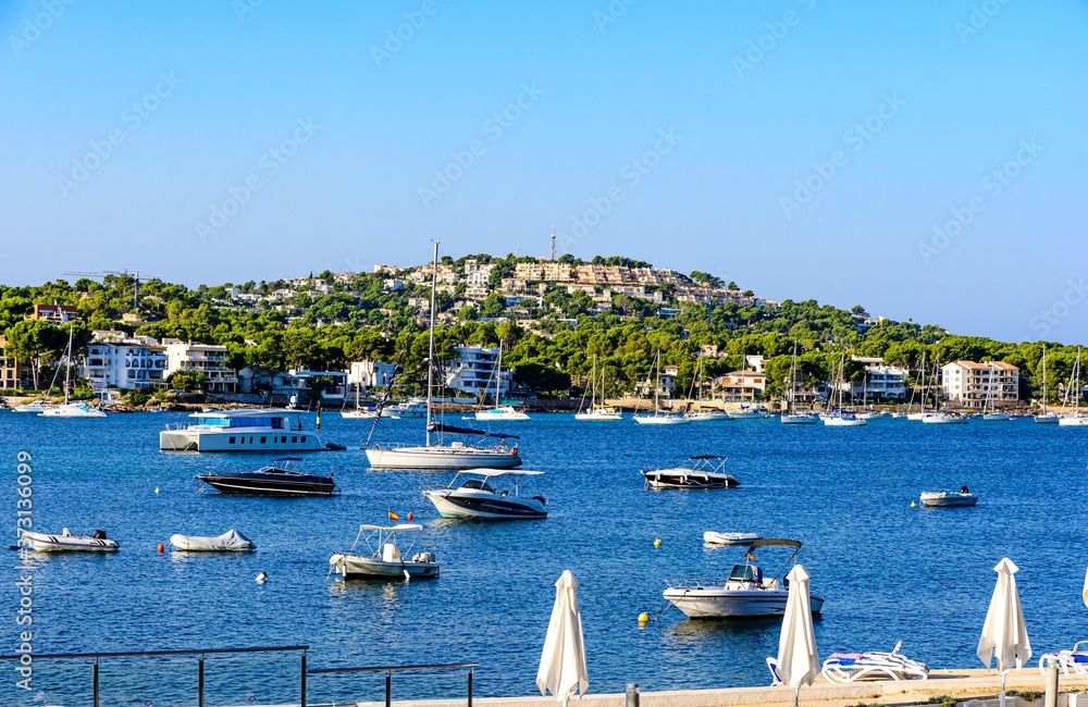 View on the mediterranean sea with boats, sailboats, mountains, blue sky. Santa Ponsa, Majorca, (Mallorca), Spain