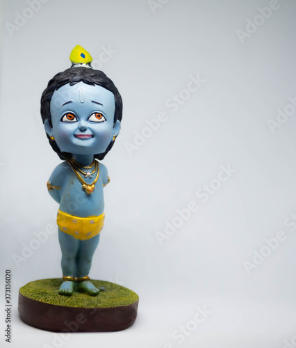 Obraz na płótnie Cute and innocent idol of Hindu God Lord Krishna