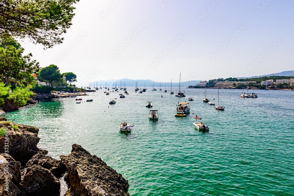 Santa Ponsa, Mallorca, Spain. View on the sea with boats, sailboats, mountains, blue sky.