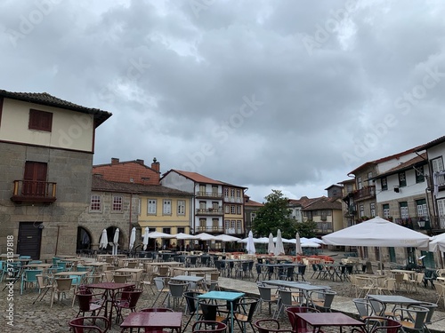 Old colourful building on a place square in Guimaraes, Portugal photo