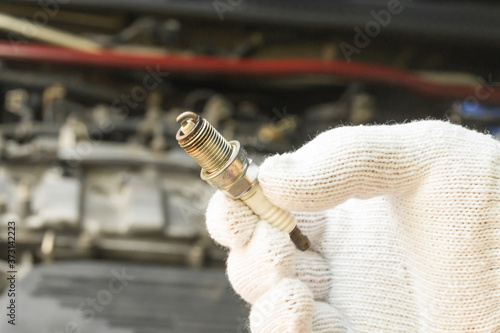 Old spark plug, Car maintenance service.