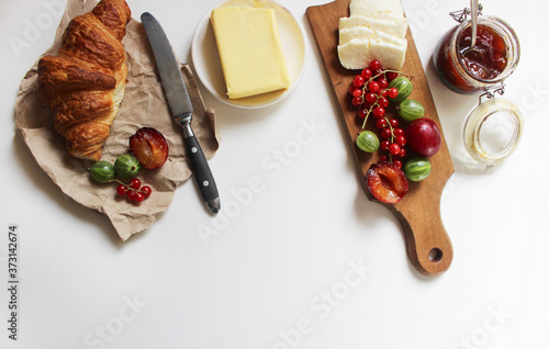 French breakfast. fresh croissant, berries and fruits. Flat lay concept.
