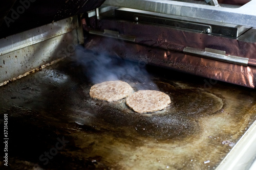 Making burgers from cutlets and shelves at McDonald's