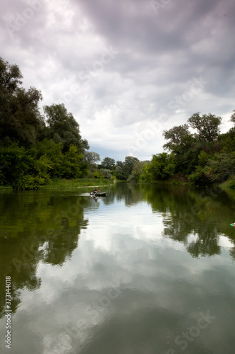 Morning on the river in the forest on a summer day