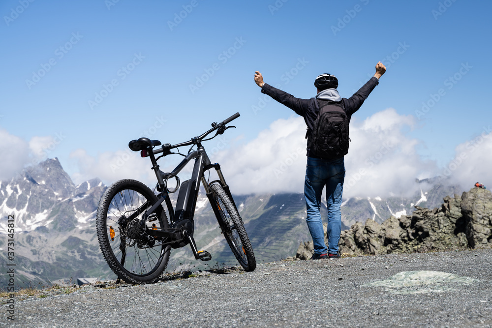 E Bike Mountain Bicycle In Austria. Excited Man Stock-Foto | Adobe Stock