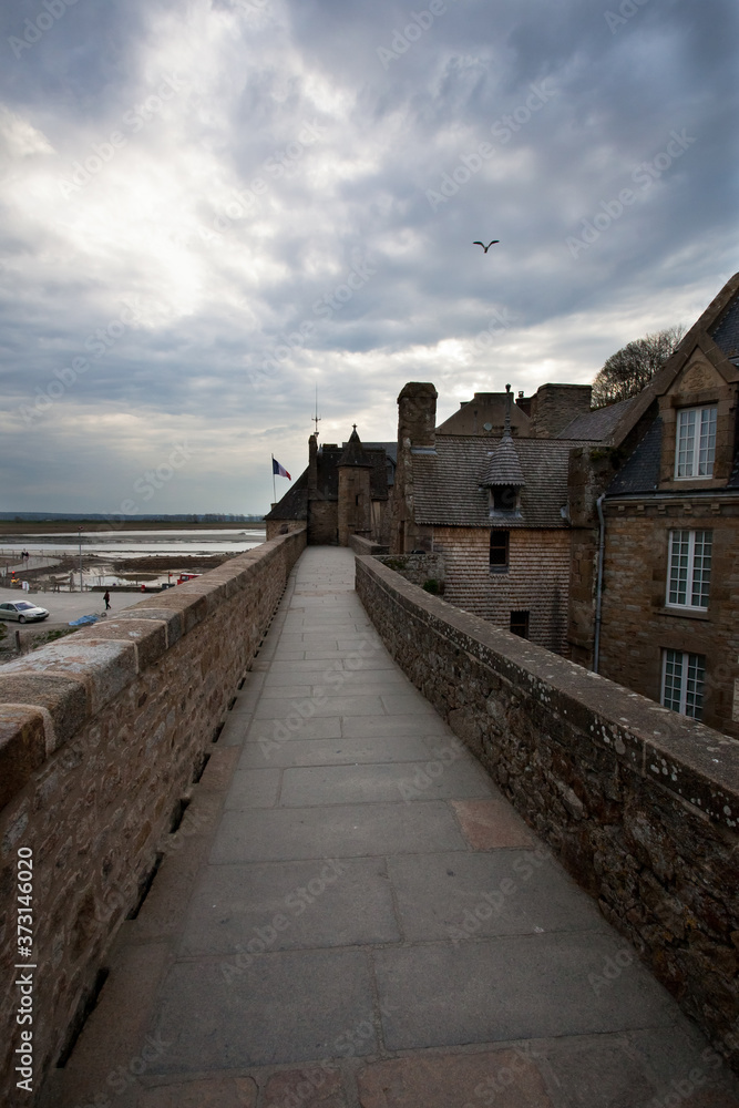 Fototapeta premium Ancient impregnable abbey fortress on an island in normandy
