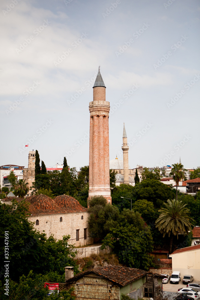 The minaret rises above the rooftops of the old town