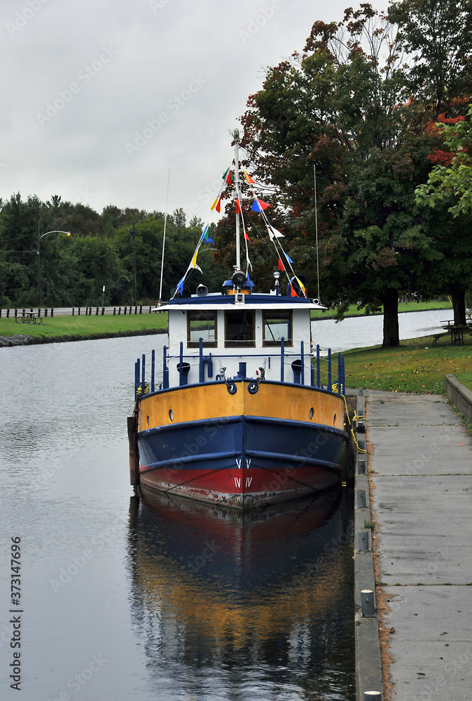 tug boat at dock in canal